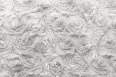 Arkaplanı kıvrımlı beyaz doğal yün. Pamuk, beyaz yün halı. Kalıplı kürk halı