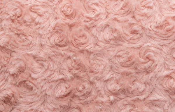Pink natural wool with twists texture background. Cotton wool, white fleece carpet. Red fur rug with pattern