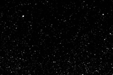 Siyah arka planda beyaz lekeler ve izler var. Beyaz bulanıklık ve dalgalanmalar. Kar yağışı, soyutlama