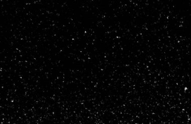 Siyah arka planda beyaz lekeler ve izler var. Beyaz bulanıklık ve dalgalanmalar. Kar yağışı, soyutlama