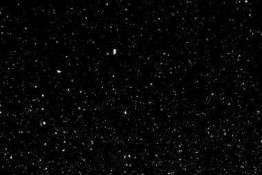 Siyah arka planda beyaz lekeler ve izler var. Beyaz bulanıklık ve dalgalanmalar. Kar yağışı, soyutlama