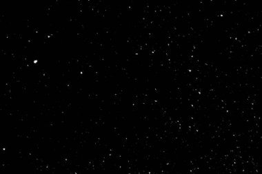 Siyah arka planda beyaz lekeler ve izler var. Beyaz bulanıklık ve dalgalanmalar. Kar yağışı, soyutlama