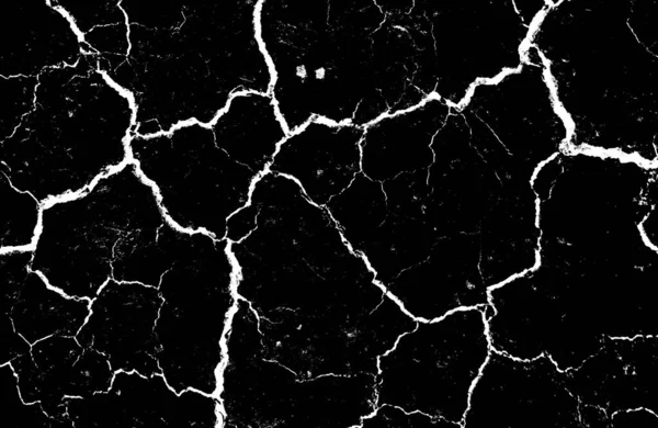 Black dried and cracked ground earth background. Closeup of dry fissure dark ground. crack on surface texture. erosion