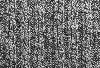 Beyaz örülmüş süveter dokusu. Gri örgü yün malzeme