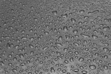 Siyah arkaplanda su damlaları, yakın çekim dokusu