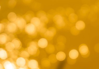 Sarı bokeh arkaplan dokusu. Altın bulanık parlak parlak ışık dokusu