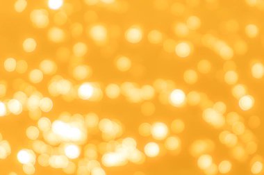 Sarı bokeh arkaplan dokusu. Altın bulanık parlak parlak ışık dokusu