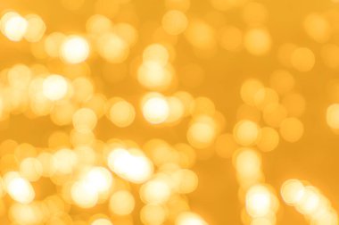 Sarı bokeh arkaplan dokusu. Altın bulanık parlak parlak ışık dokusu