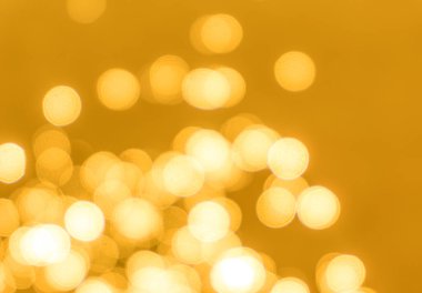 Sarı bokeh arkaplan dokusu. Altın bulanık parlak parlak ışık dokusu