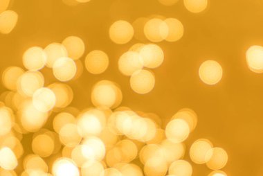Sarı bokeh arkaplan dokusu. Altın bulanık parlak parlak ışık dokusu
