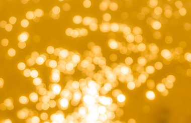 Sarı bokeh arkaplan dokusu. Altın bulanık parlak parlak ışık dokusu