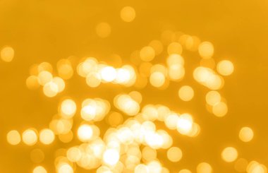 Sarı bokeh arkaplan dokusu. Altın bulanık parlak parlak ışık dokusu