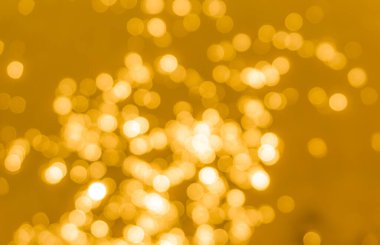 Sarı bokeh arkaplan dokusu. Altın bulanık parlak parlak ışık dokusu