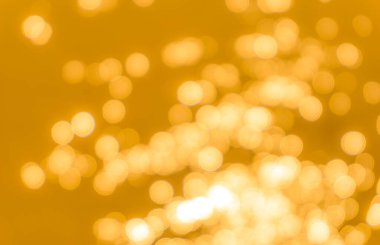 Sarı bokeh arkaplan dokusu. Altın bulanık parlak parlak ışık dokusu