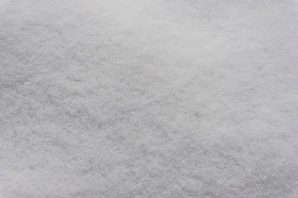 White snow texture, background of fresh snow texture in blue tone