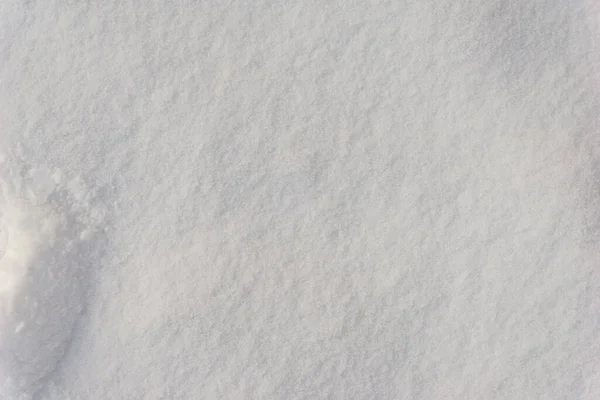 White snow texture, background of fresh snow texture in blue tone