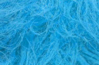Mavi tüylü yün dokusu, hayvan yünü arka planı, boyanmış kürk dokusu yakın plan.