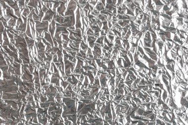 Gümüş kırışık folyo arka plan dokusu, buruşuk alüminyum folyo, soyut parlak arkaplan