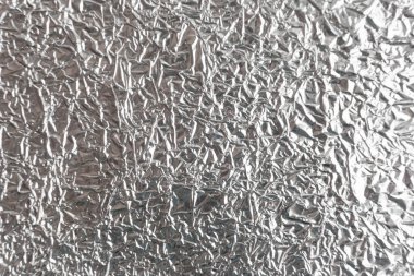 Gümüş kırışık folyo arka plan dokusu, buruşuk alüminyum folyo, soyut parlak arkaplan