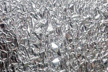 Gümüş kırışık folyo arka plan dokusu, buruşuk alüminyum folyo, soyut parlak arkaplan