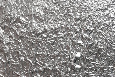 Gümüş kırışık folyo arka plan dokusu, buruşuk alüminyum folyo, soyut parlak arkaplan