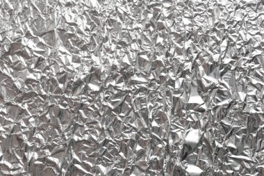 Gümüş kırışık folyo arka plan dokusu, buruşuk alüminyum folyo, soyut parlak arkaplan