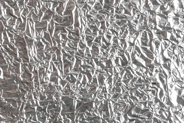 Gümüş kırışık folyo arka plan dokusu, buruşuk alüminyum folyo, soyut parlak arkaplan