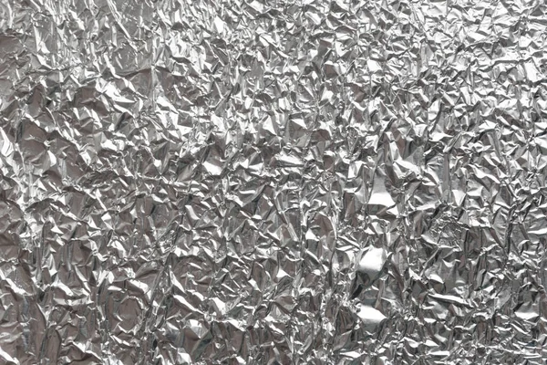 Gümüş kırışık folyo arka plan dokusu, buruşuk alüminyum folyo, soyut parlak arkaplan