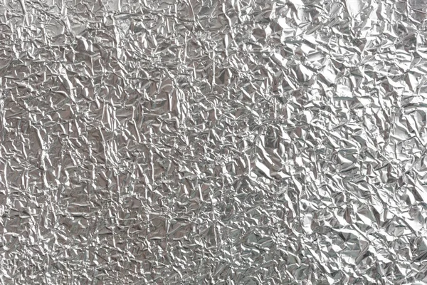 Gümüş kırışık folyo arka plan dokusu, buruşuk alüminyum folyo, soyut parlak arkaplan