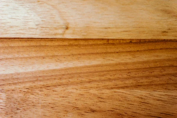 Kahverengi ahşap ahşap kaplama arka plan, grunge kesim tahtası, doğal desenli ceviz ağacı deseni.