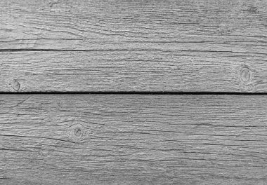 Eski ahşap ahşap döşemeler, arka planda gri boya var.