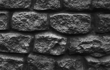 Taş blok dokusu arkaplanından siyah duvar
