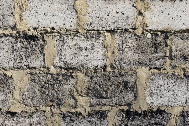 Beton bloklardan oluşan gri eski duvar arka plan, gri eskimiş beton tuğlalar.