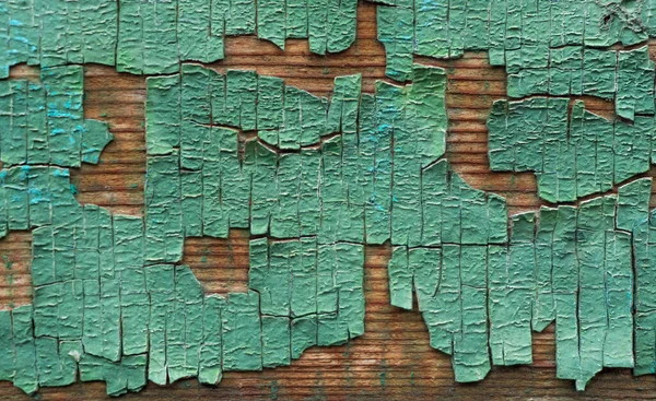 木板底座上的绿色旧油漆 — 图库照片