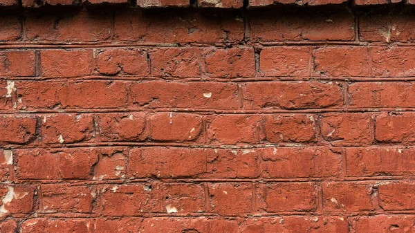 Texture of old red brick wall, dirty weathered painted red brick, grunge dark brown background