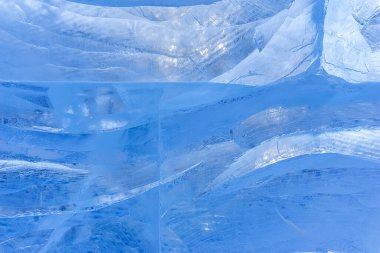 Modeli olan mavi buz dokusu ve çatlaklar arka plan, donmuş buz pateni pisti kış arka planı, tasarımcılar için buz yüzeyi dokusu, donmuş su blokları