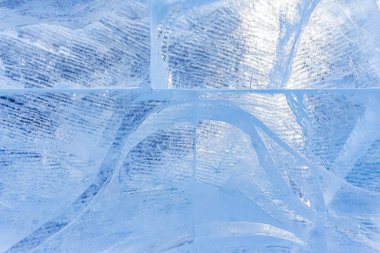 Modeli olan mavi buz dokusu ve çatlaklar arka plan, donmuş buz pateni pisti kış arka planı, tasarımcılar için buz yüzeyi dokusu, donmuş su blokları