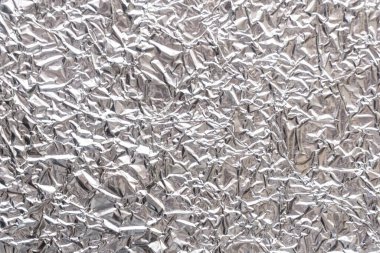 Gümüş kırışık gıda folyo arka plan dokusu, buruşuk alüminyum folyo, soyut parlak arka plan
