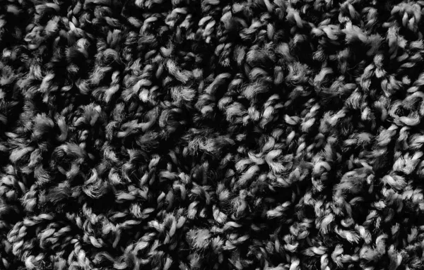 黑色地毯背景纹理 灰色纺织品纹理 蓬松地毯背景 深色羊毛面料纹理 灰色毛茸茸的地毯 碎片毛茸茸的垫子 带图案抽象的材料 — 图库照片
