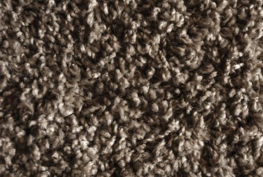 Kahverengi kıvırcık yün arka plan dokusu, kestane rengi halı, kabarık halı, koyu yün kumaş dokusu.