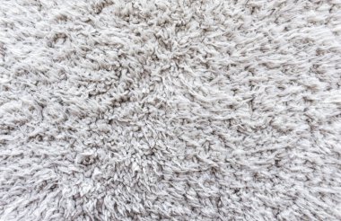 Beyaz yün doku arka plan, açık doğal koyun yünü, beyaz tüylü kürk dokusu, parça parça gri halı, gri halı