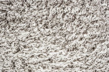 Beyaz yün doku arka plan, açık doğal koyun yünü, beyaz tüylü kürk dokusu, parça parça gri halı, gri halı