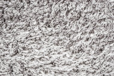 Beyaz yün doku arka plan, açık doğal koyun yünü, beyaz tüylü kürk dokusu, parça parça gri halı, gri halı