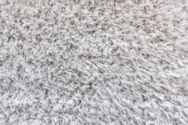 Beyaz yün doku arka plan, açık doğal koyun yünü, beyaz tüylü kürk dokusu, parça parça gri halı, gri halı