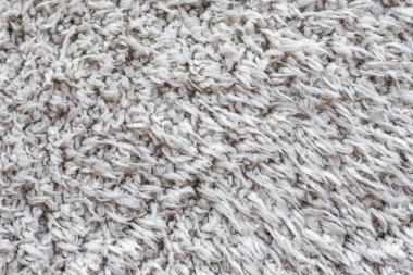 Beyaz yün doku arka plan, açık doğal koyun yünü, beyaz tüylü kürk dokusu, parça parça gri halı, gri halı