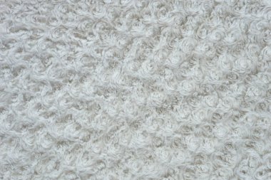 Kıvrımlı beyaz yün, pamuk, hafif doğal koyun yünü, beyaz tüylü kürk dokusu, halı, örgü desenli beyaz yün.