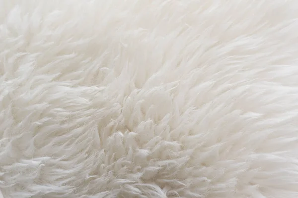 White soft wool texture background, seamless cotton wool, light natural sheep wool, close-up texture of white fluffy fur, wool with beige tone for designer