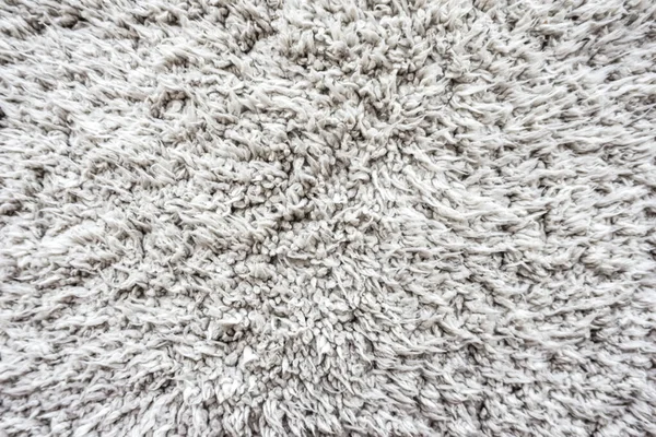 white wool texture background,  light natural sheep wool, texture of white fluffy fur, fragment gray wool carpet, gray mat, grey rug