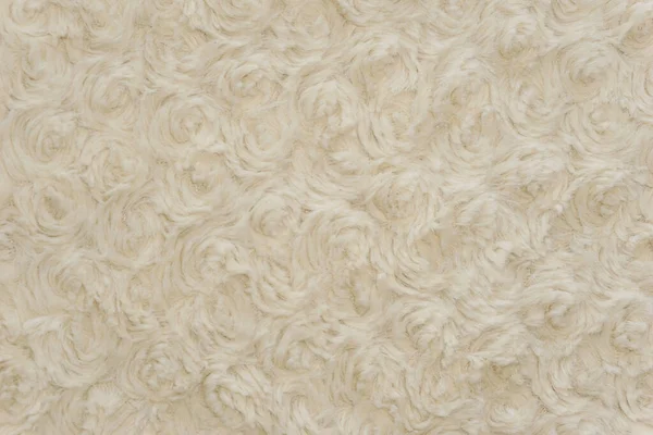 White wool texture background, cotton wool, white natural sheep wool, beige fluffy fur, fragment white carpet, close-up light wool with detail of woven pattern, factory fabric material with a twist