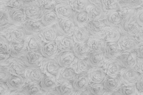 Фон текстуры белой шерсти, вата, белая натуральная овечья шерсть, бежевый пушистый мех, фрагмент белого ковра, крупным планом светлая шерсть с деталями тканого узора, фабричный материал с твистом